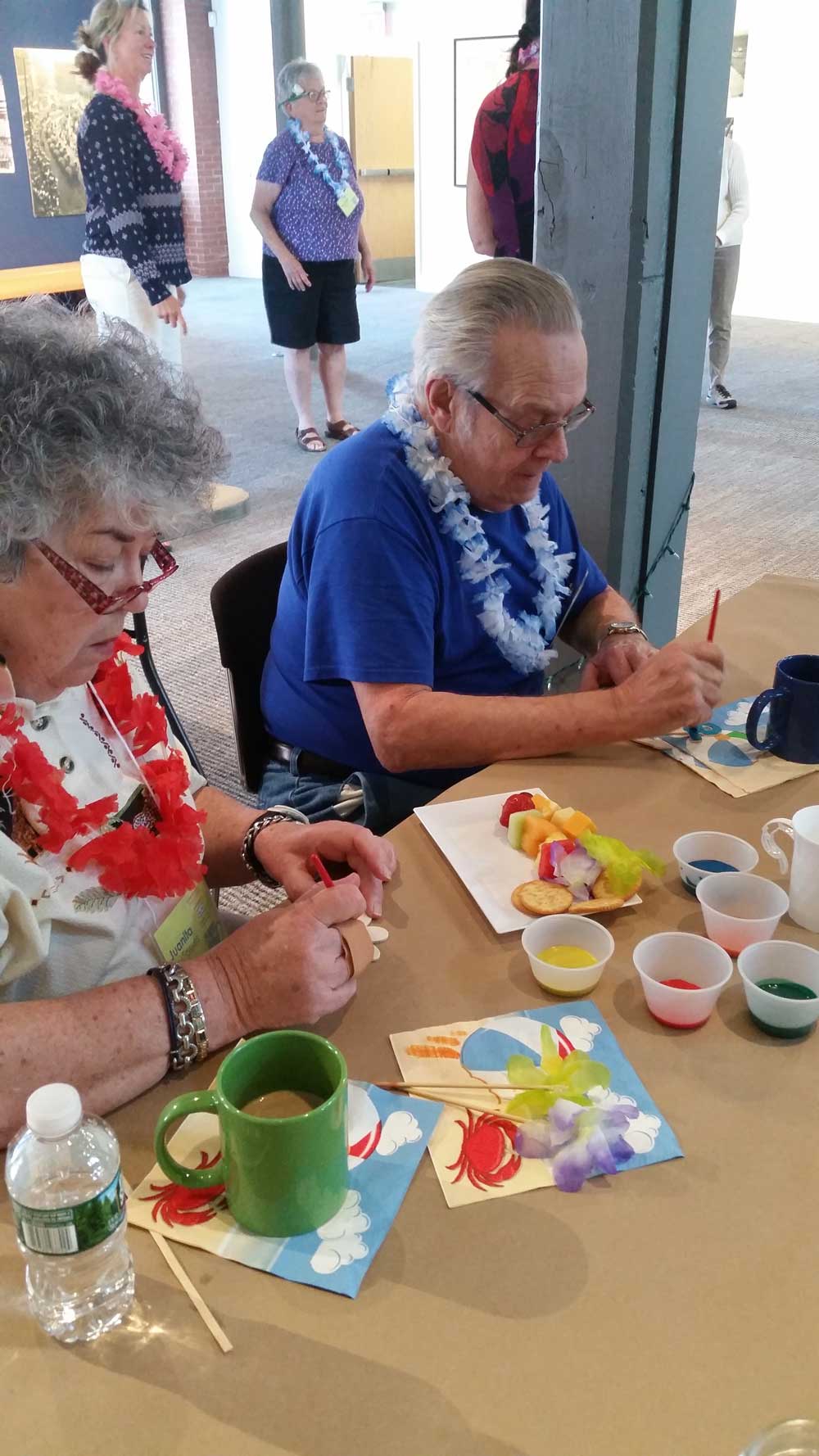 Older Man and Woman Making a Hawaiin Craft