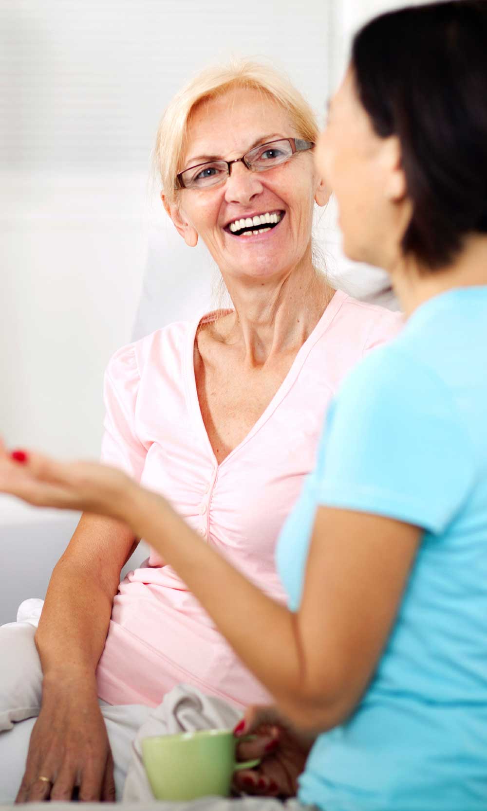 Two Women Talking on a Couch