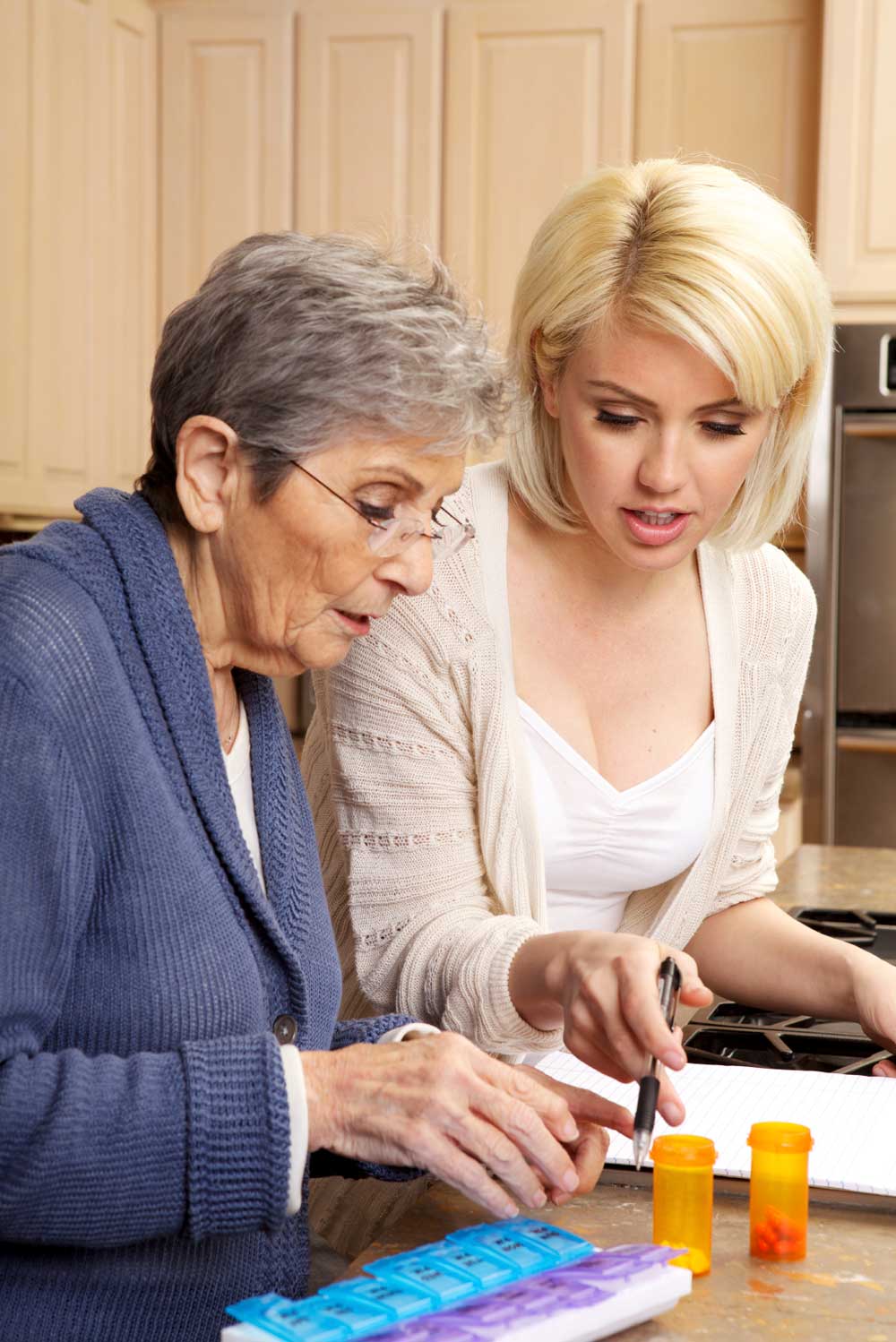 Mother and Daughter Filling Pillbox