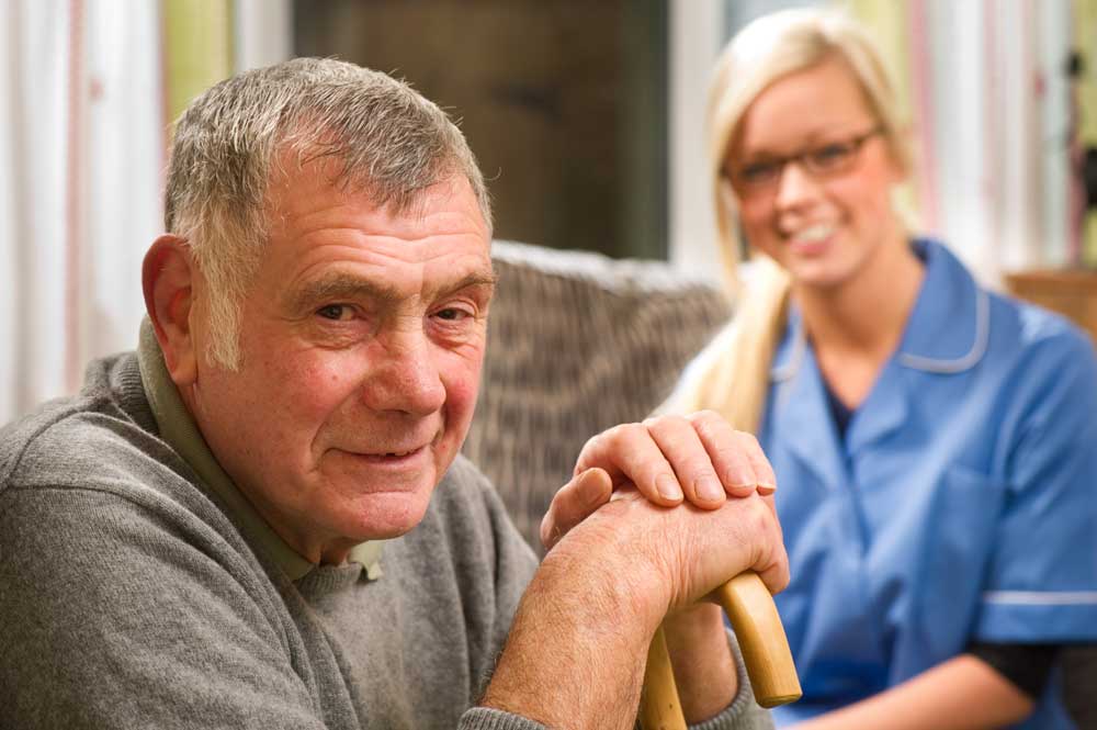 Older Man with a GLSS Worker