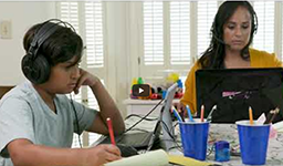 Mother and son sitting at a table