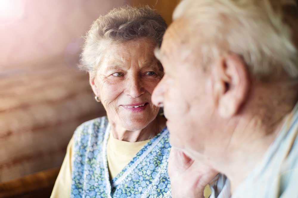 Serious Senior Woman Looking at Husband