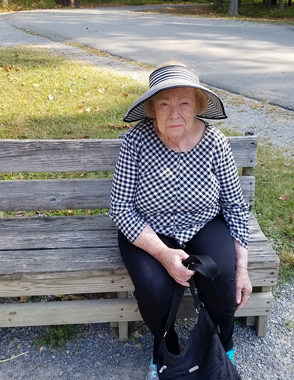 woman sitting alone on a bench